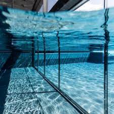 Go down the stairs and then to the opposite side of where you entered the room. Underwater Swimming Pool Doors Metek Ltd