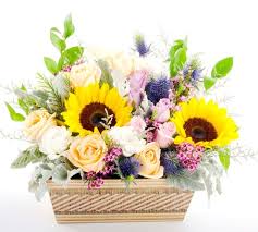 With an abundant array of bright red, yellow and purple flowers, this arrangement is sure to brighten your day. Brighten Your Day With Flowers From Angel Florist