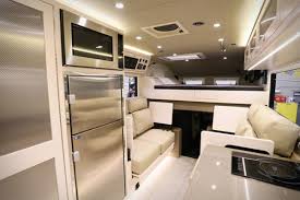 Interior appointments include maple cabinetry, a king size loft bed over the truck cab, pull out synthetic leather sofa, tv, induction stove, 10 inch stainless sink, refrigerator, microwave, ambient lighting and wifi. Shop Spotlight Earthroamer Extreme Xv Not Rv