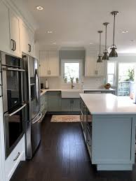 Modern Country Kitchen With Blue Grey And White Two Tone Cabinets Antique Brass Hardware Gray And White Kitchen Kitchen Cabinets Grey And White White Kitchen