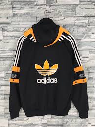 Adidas Black And Orange Jacket Clothing Jacket Adidassweater Adidasjumper Adidastrefoil Adidastracktop Niketracktop Nikewind Adidas Outfit Men Adidas Jacket Windbreaker Adidas Outfit