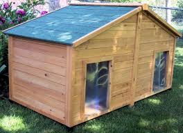 Brown Wooden Dog House Having Double Doors With Plastic Curtains Also Gray Sliding Roof Placed On The Green Grass Wooden Dog House Wood Dog House Dog House Diy