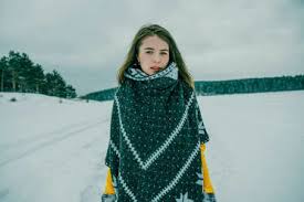 Maybe you would like to learn more about one of these? Woman In Warm Clothes In The Winter Forest Stockphoto