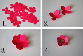 To make a paper flower, fold a piece of origami paper in half from left to right and from bottom to top, and then on both diagonals, so you end up with folds in the shapes of a cross and an x. tuck the sides in and collapse. Diy Paper Flower Tutorial Step By Step Instructions