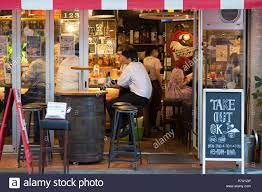 Download This Stock Image Tokyo Japan 23rd June 2016 Customer Enjoying Food And Drinks Inside A Tokyo Street Cafe Bar Cafe Bar Tokyo Street Stock Photos