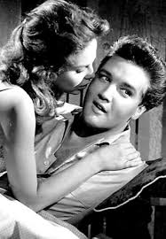 Rock and roll icon Elvis Presley stops at Weeki Wachee July 30, 1961 and  poses with two lovely mermaids as a crowd of over 5000 fans await him. He  was staying at
