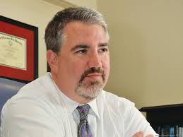 University at Albany athletics director Mark Benson is working to change  the way his school markets its Division I football program