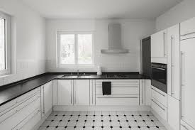 29 Kitchens With White Cabinets and Black Countertops Worth Copying