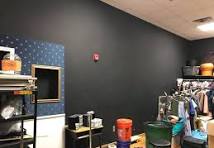 Setting up set and costume storage for a community theatre