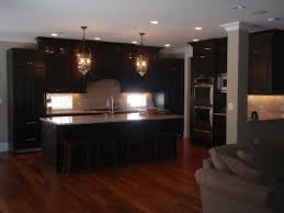 Espresso kitchen cabinets are often seen in modern design as this color refers to the palette of natural contemporary kitchen design with espresso stained kitchen cabinets kitchen island white stone counter tops gray glass tiles espresso kitchen cabinets with white appliances espresso. What Color Hardwood Floor With Espresso Cabinets Youtube