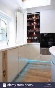 a modern white kitchen inside a home in
