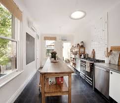 Simply adding an extra bit of space to your home with a kitchen extension will not dramatically improve it, it can in fact have the opposite effect! Window Light Long Wood Table Double Oven Gas Stove Chalkboard Backsplash Everythin Long Narrow Kitchen Layout Narrow Kitchen Layout Long Narrow Kitchen