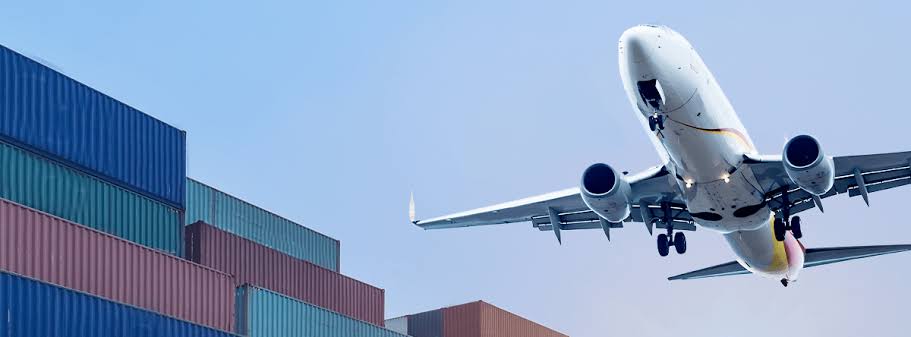Time-critical cargo being loaded onto a plane on the tarmac at night