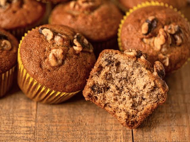 Bakery-style banana muffins made with standard all-purpose flour., AI generated