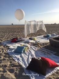 Due to its location and size this is a popular beach for sunbathing. Birthday Huntington Beach Bonfire Party White Lace Backdrop Big Balloon Decorative Pillows Lanterns Rugs Beach Bonfire Parties Bonfire Party Beach Bonfire