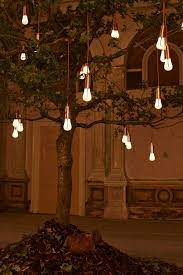 Plumen S Glowing Oak Installation At London Design Festival Landscape Lighting Design Light Bulb Design Solar Lights Garden