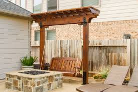 The hanging porch swing fire pit build. Pergola Swing Traditional Patio Houston By Homescapes Houzz