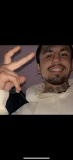 Can someone add angel wings to my son's picture?