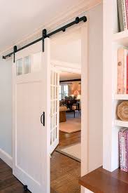 Sliding Paneled Barn Door With Glass Windows White Inside Barn Doors Barn Door Designs Glass Barn Doors