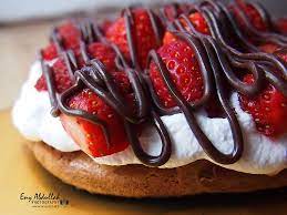 Rich chocolate meringue layers sandwiched with chocolate whipped cream and berries! Double Chocolate Pavlova