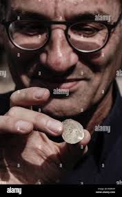 24 gold coins hi-res stock photography and images