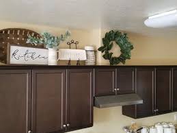 Modern In 2021 Decorating Above Kitchen Cabinets Cabinet Decor Top Of Cabinet Decor
