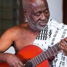 Bokaye, a wonderful singer and master of the harp of Gabon, known as  ngombi, displaying his formidable skills.
