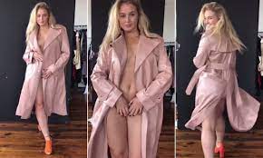 Iskra Lawrence shares video of herself modeling an open trench coat and  thong | Daily Mail Online