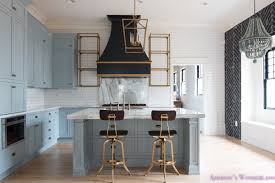 white subway backsplash tile gold