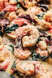 Creamy Tuscan Garlic Shrimp Is The Most Amazing Creamy Shrimp Dish A Creamy Garlic Parmesan Sauce With Spina In 2020 Garlic Shrimp Recipe Garlic Shrimp Shrimp Recipes