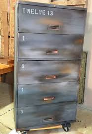 When it dried i sprayed the whole thing with white primer and added white satin spray paint next. Not Your Boring File Cabinet Anymore Hometalk