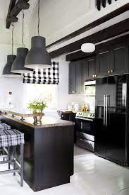 The rich black stain on these cabinets emphasizes the clean lines, sleek hardware, and beautiful wood grain. 11 Black Kitchen Cabinet Ideas For 2020 Black Kitchen Inspiration