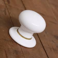 ceramic door knobs white with brass