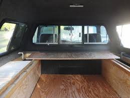 what to know when choosing a truck canopy for camping desk