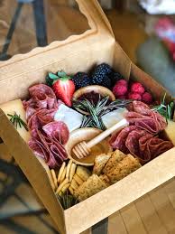 Forget individual appetizers and assemble an interactive board that brings together the best of crudités, cheese and charcuterie. Small Charcuterie Graze Box Picnic Food Party Food Platters Food