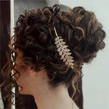Using a curler, curl the hair around the tips, to give it a sassy look. 40 Creative Updos For Curly Hair