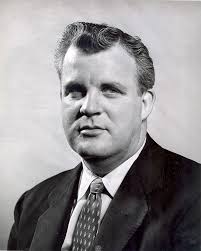 Columbus Citizen staff outside the building at 34 North 3rd Street. Left to  right: Lloyd Flowers (bow tie), Wink Hess (in background), Don Weaver,  editor (with pipe), Jimmy Mccann (glasses), Ed Colston (
