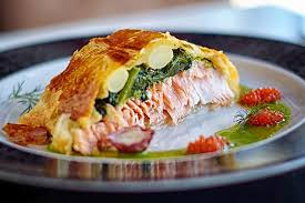 Season both sides of the salmon fillets with salt and pepper and divide salmon onto the aluminum foil near the center then place trimmed asparagus to one side of the salmon, following the long direction of the foil. Puff Pastry Salmon With Spinach Asparagus And Water Cress Sauce Picture Of La Cata Benijofar Tripadvisor