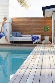 An Interior Stylist S Black And White Beach Bungalow Wooden Pool Deck Decks Around Pools Swimming Pool Landscaping