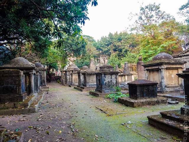 Historic tombs under lush foliage at South Park Street Cemetery, AI generated