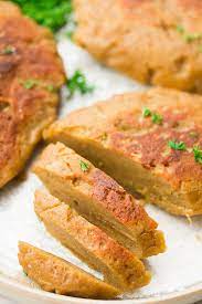 In the bowl of a stand mixer, fitted with the dough hook, combine the vital wheat gluten and the blended liquid. Vegan Chicken Nora Cooks