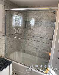 Installed This Clean Semi Frameless Bypass Slider With Chrome Hardware And Double Towel Bars In Lynnfield This W Framed Shower Door Shower Doors Framed Shower
