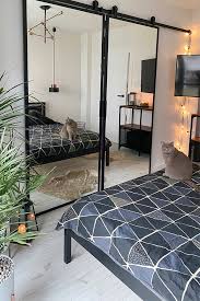 The picture in this post of the bedroom is basically the layout to my bedroom…except above where the bed is there is a window 🙁 if i move it to the wall with the closet on which is the only solid wall to place it on i cannot see who enters the room from the bed, my only other options is the bed under and centered between the two windows (i. Double Sliding Door With Mirror In A Modern Bedroom Reno Doors