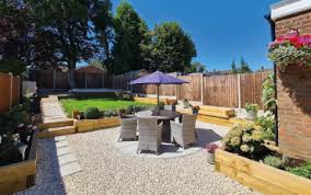 Raised herb garden bounded by a western red cedar fence, and arbor gate. How To Use Railway Sleepers In Your Garden Suregreen S Guide To Timber Sleepers