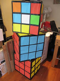 One easy approach is to cut out a template and glue it into the shape of a cube. Giant Rubik Cube Made Out Of Card Board Box Rubics Cube Rubiks Cube 80s Theme Party