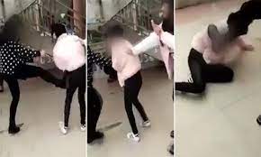 Hunan teen bullies slap, kick and beat a school girl because 'she looks too  pretty' | Daily Mail Online