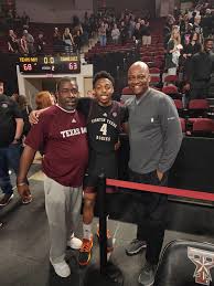 Coach Brown, Lesley Booker and Wade Taylor at the Aggies Basketball Game in  support of Wade Taylor