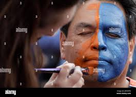 Roy Ramos gets his face painted beforef Game 3 of baseball's World Series  between the Houston Astros and the Los Angeles Dodgers Friday, Oct. 27,  2017, in Houston. (AP Photo/Eric Gay Stock