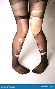 Legs with torn pantyhose stock photo. Image of destroyed - 2559422