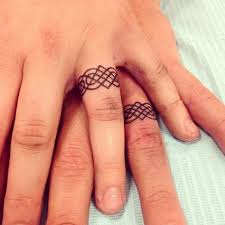 150 Amazing Wedding Ring Tattoo Design Ideas December2020 Wedding Ring Finger Tattoos Ring Tattoo Designs Wedding Band Tattoo